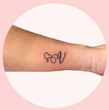 Curvy V Letter Tattoo Design On The Hand