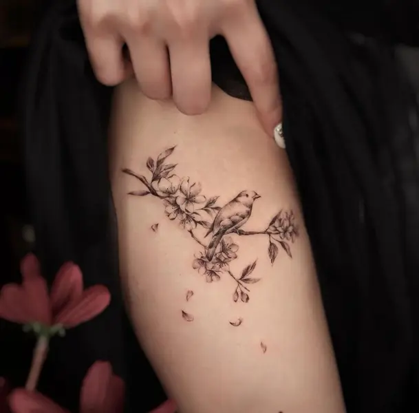 MInimalist lotus flower tattoo on the hip