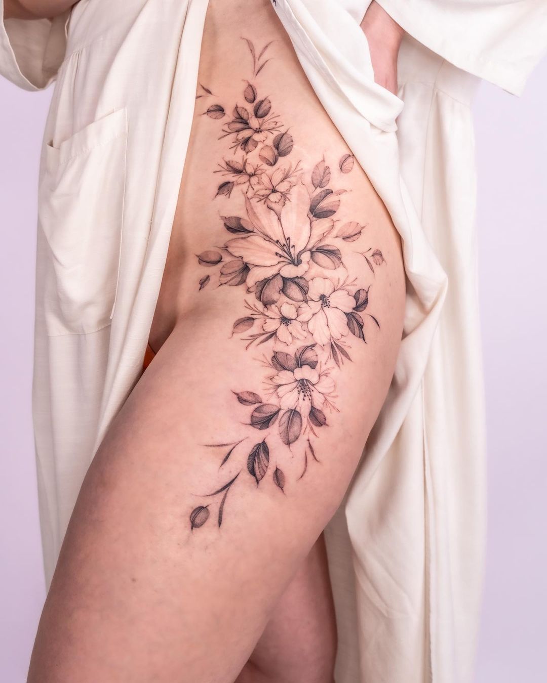 Delicate Flora On Skin Thigh Tattoo Design