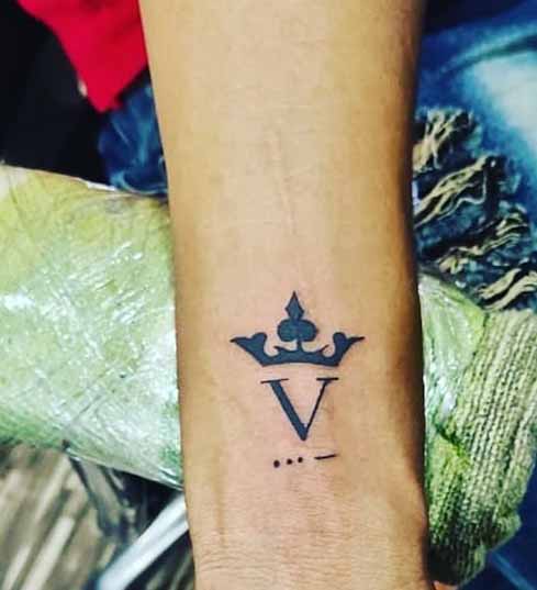 Enticing V Alphabet Tattoo With A Crown