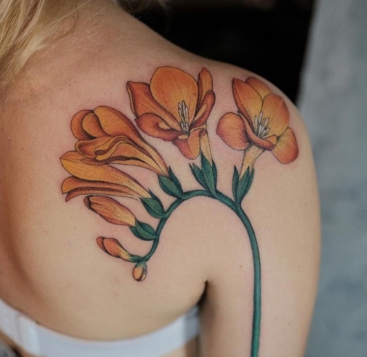 Gorgeous Freesia Tattoo On The Back