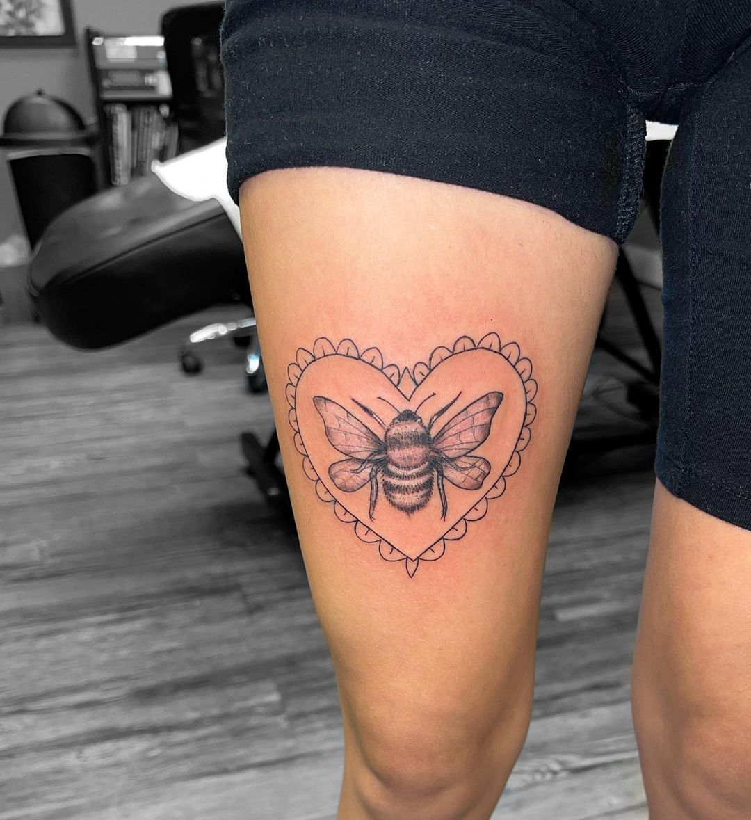 Heart Encased Bee Thigh Tattoo