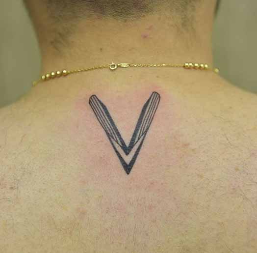 Magnetic V Word Tattoo On The Back