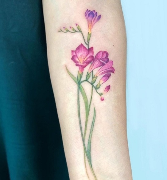 Purple Freesia Tattoo On Forearm