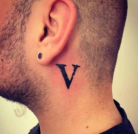 Secretive V Letter Tattoo Behind The Ear