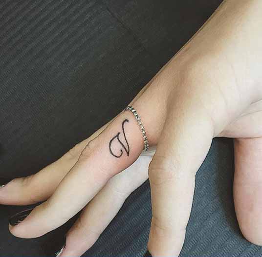Splendid V Letter Tattoo On The Finger