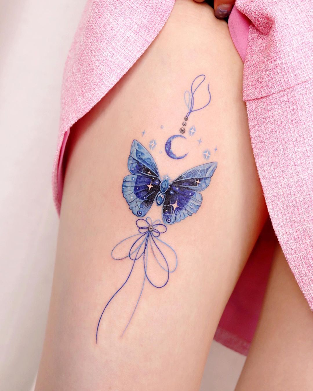 Stunning Blue Butterfly Thigh Tattoo