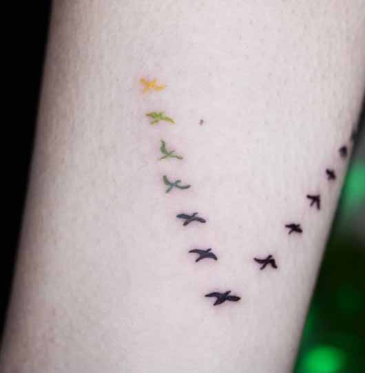 Tattoo Style For Letter V With Flying Birds