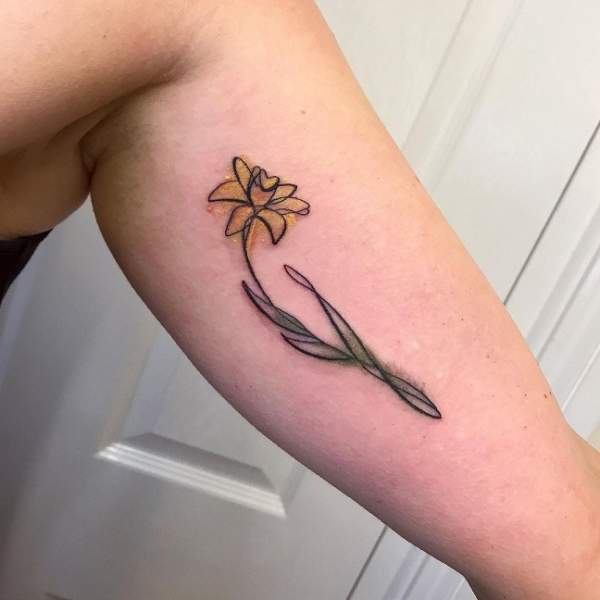 Tiny Daffodil Tattoo On The Leg