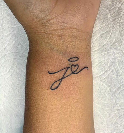 Stylish Tattoo On Wrist With A Heart And Halo