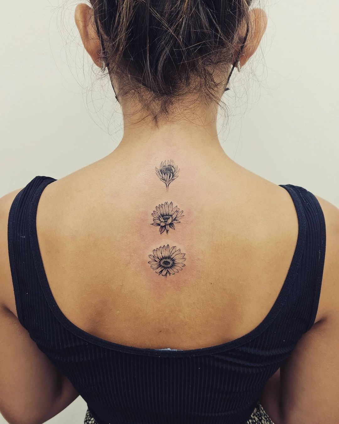 Descending Sunflower Back Tattoo In Fine Line