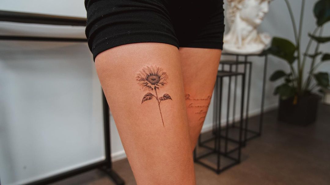 Subtle Sunflower Thigh Tattoo