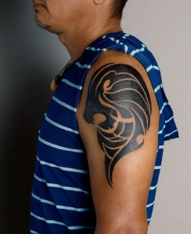 Ferocious Tribal Lion Shoulder Tattoo