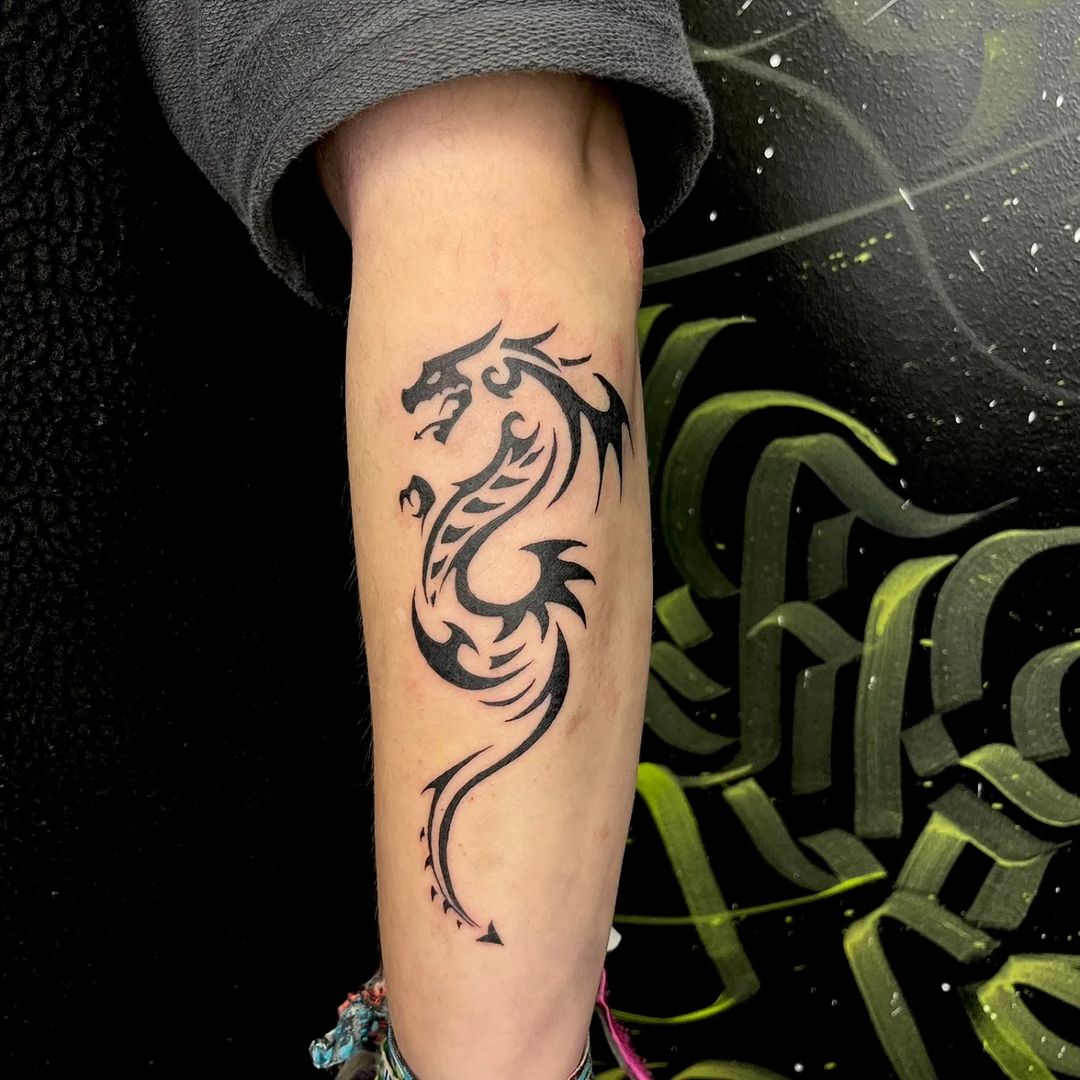 Simple Tribal Dragon Forearm Tattoo