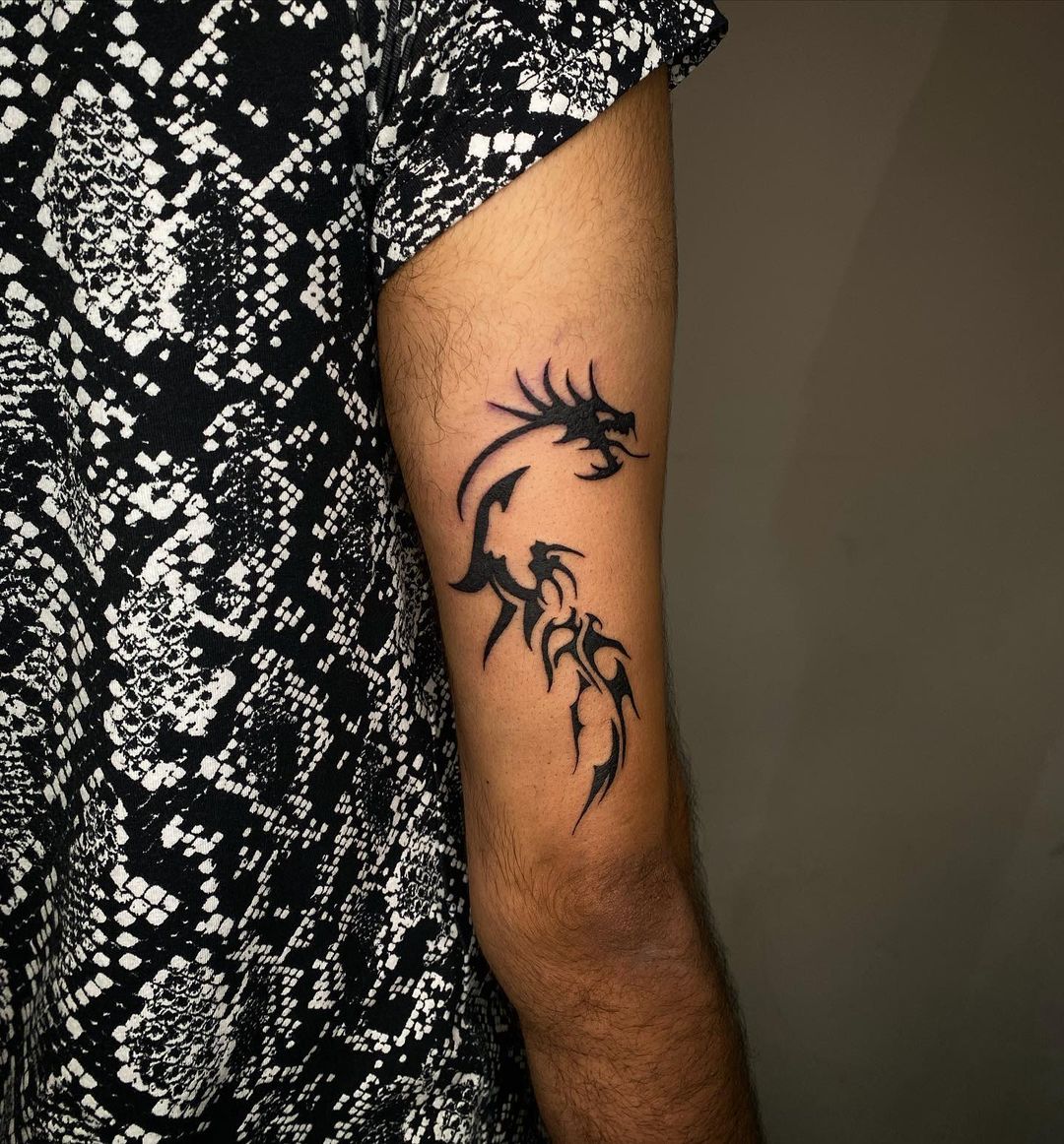 Tribal Dragon Bicep Tattoo