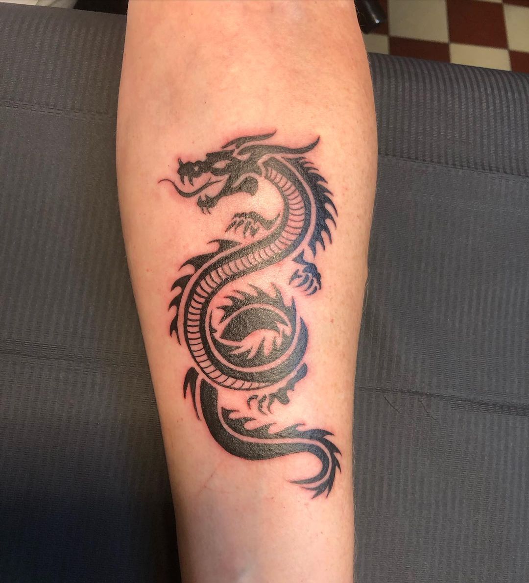 Tribal Dragon Forearm Tattoo