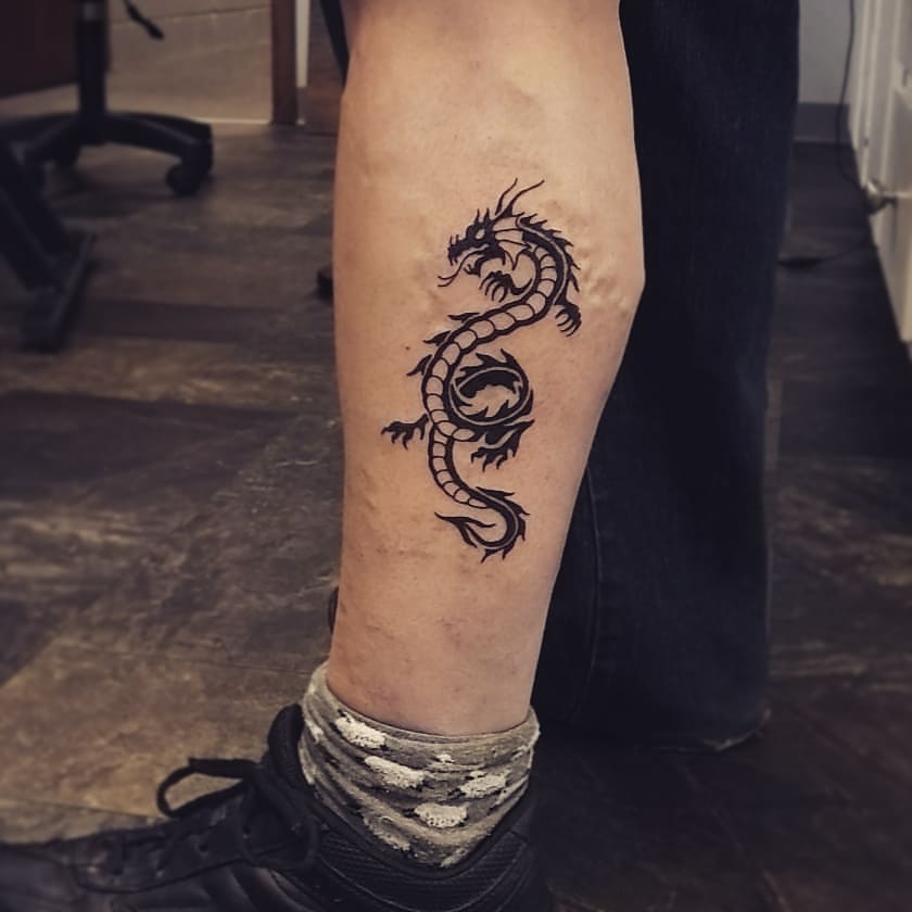 Tribal Dragon Leg Tattoo