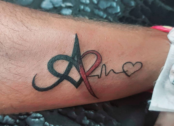 A Letter Tattoo Design With A Heartbeat