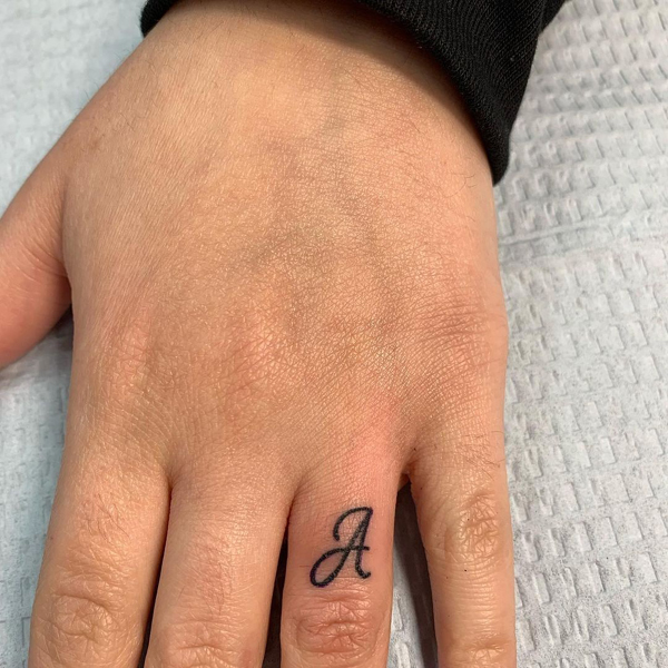 A Letter Tattoo On The Ring Finger