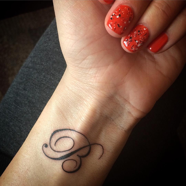 Cursive B Letter Tattoo On The Wrist