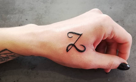 Cute Z Letter Tattoo Near The Thumb