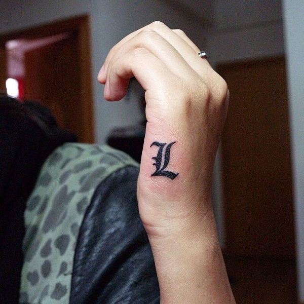 L Letter Tattoo On The Side Of The Palm