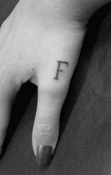 Letter F Tattoo On The Thumb