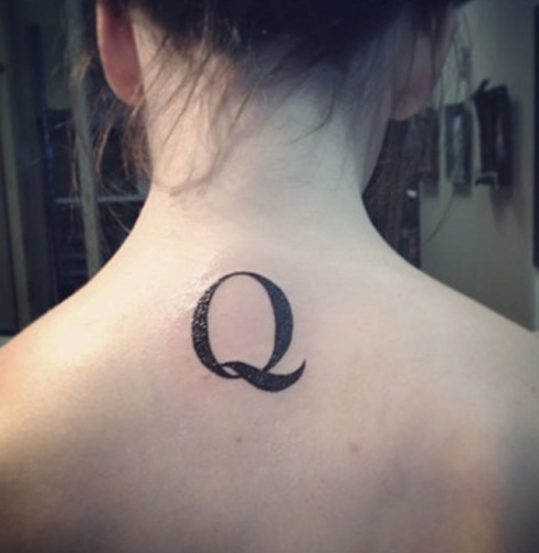 Q Alphabet Tattoo On The Back Of The Neck