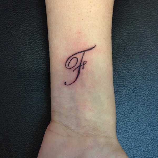 Voguish F Letter Tattoo On The Wrist