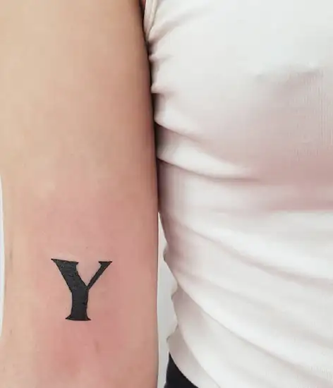 Letter Y tattoo done on the upper arm