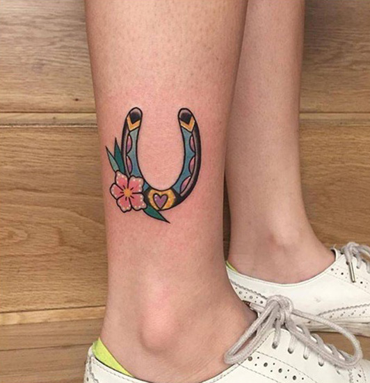 Colorful U Letter Tattoo Near The Ankle