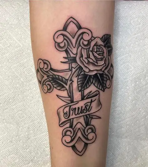 cross leg tattoo