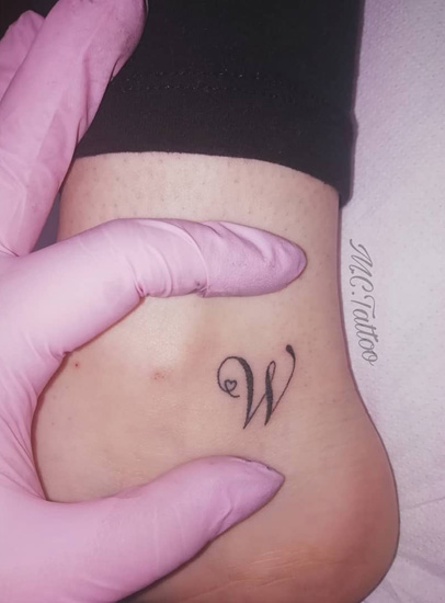 Cursive W Letter Tattoo With A Small Heart