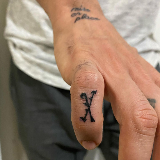 Fiery X Letter Finger Tattoo