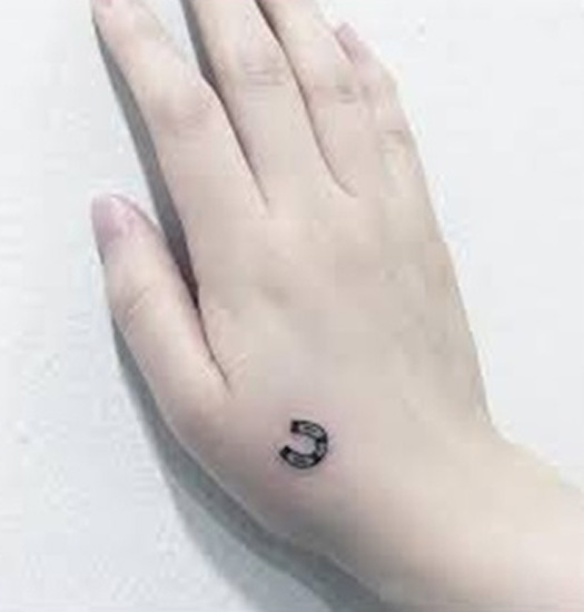 Tiny U Letter Tattoo Design