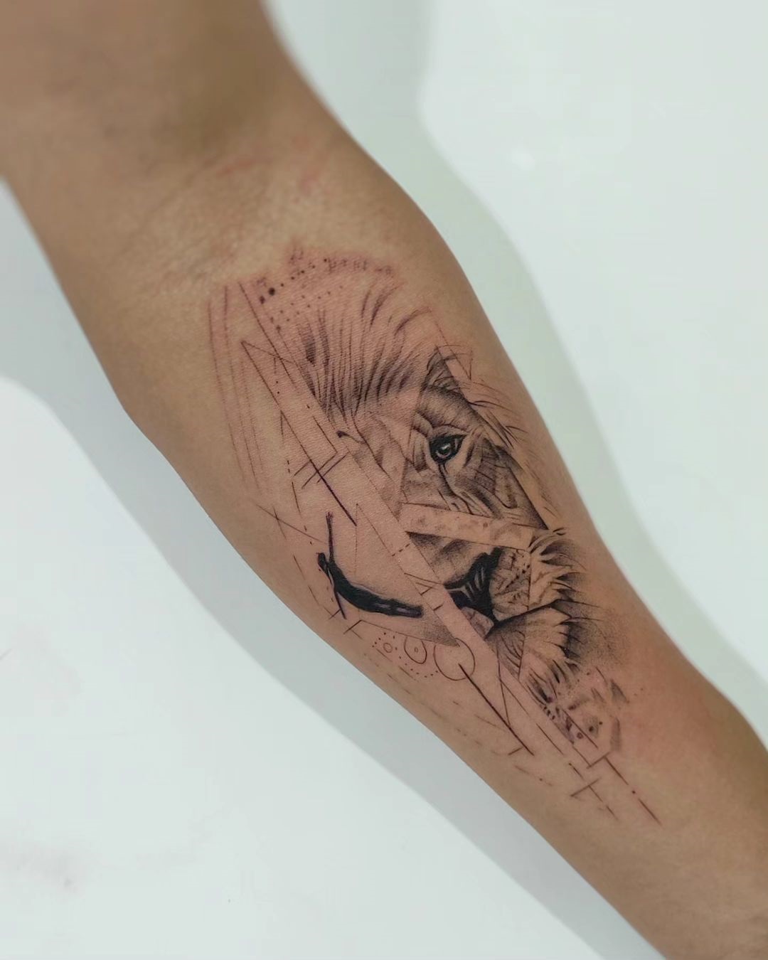 Abstract Lion Sketch Forearm Tattoo