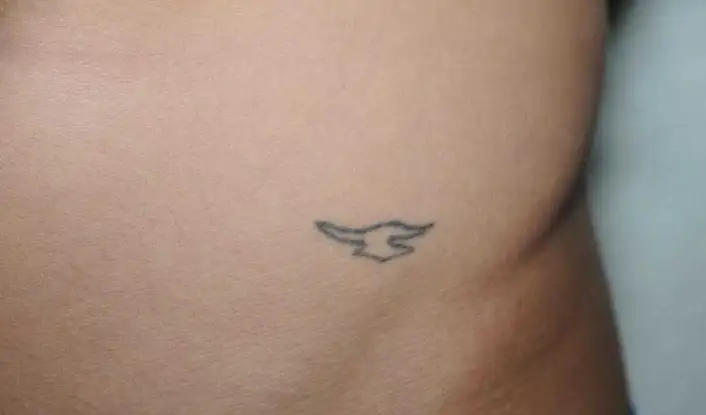 Justin Biebers wings tattoo on the back of his neck