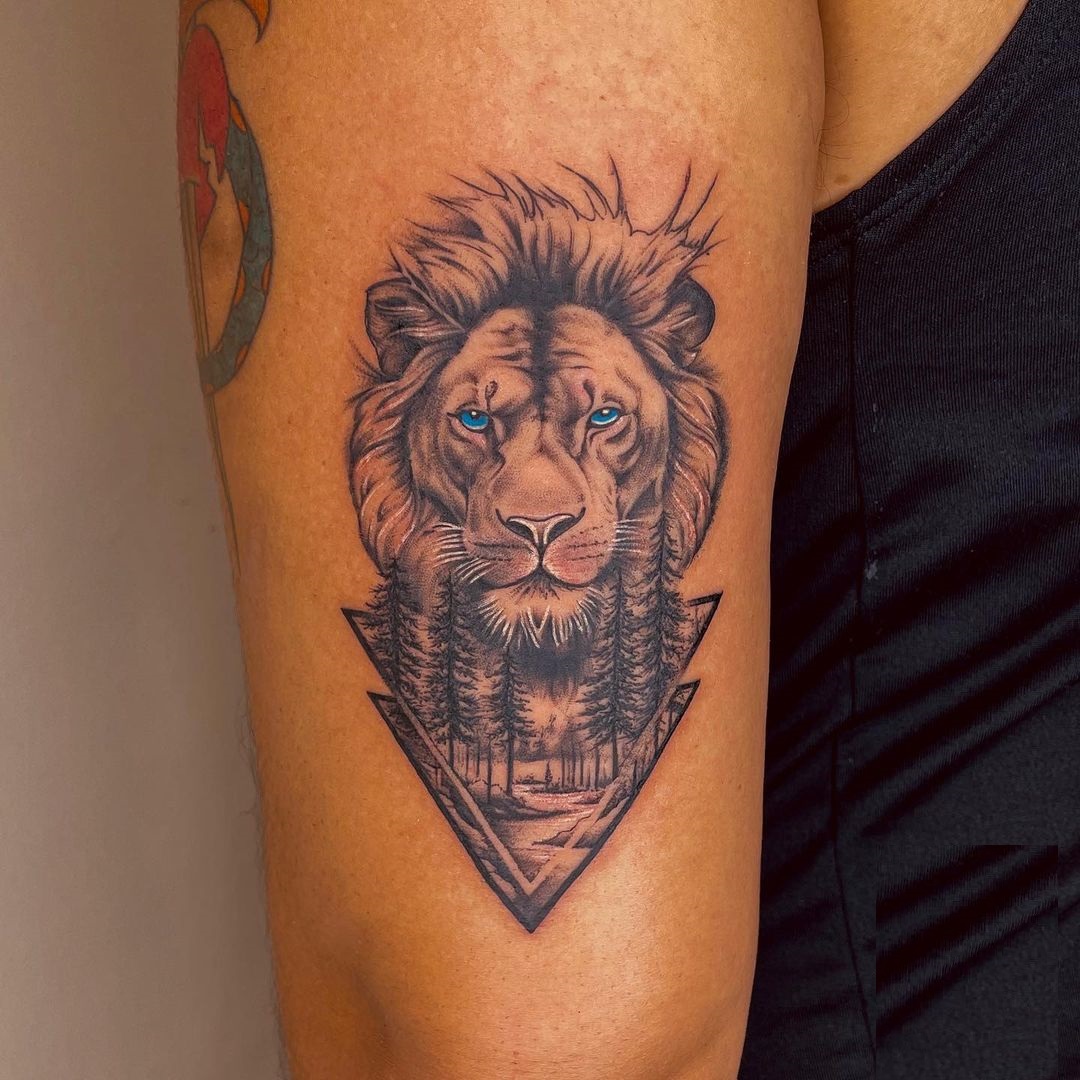 Nature Infused Lion With Blue Eyes Tattoo