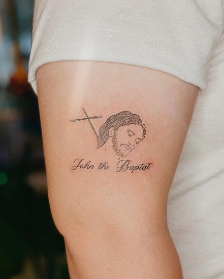 Sleek Jesus Face Tattoo On The Arm