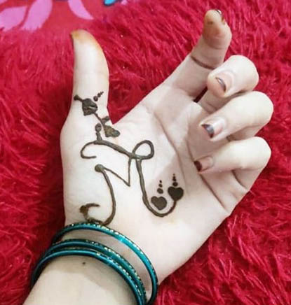 M Letter Mehndi Tattoo With Hearts