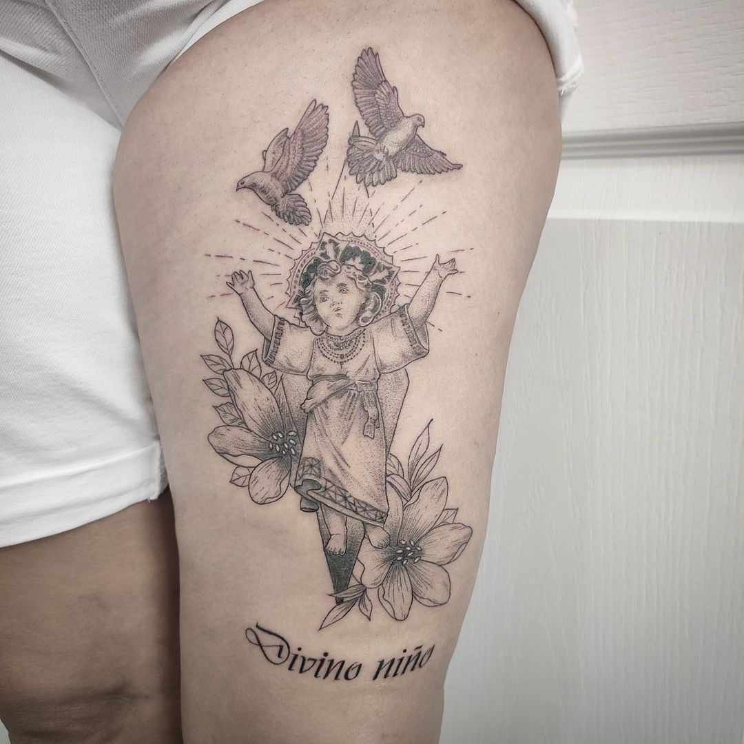 Divine Child Jesus And Holy Lilies Tattoo On Thigh