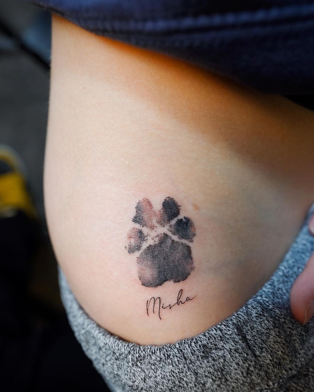 Realistic Paw Print Tattoo With Name On Elbow Side