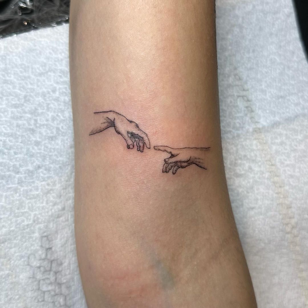 Touch Of Connection Small Arm Tattoo