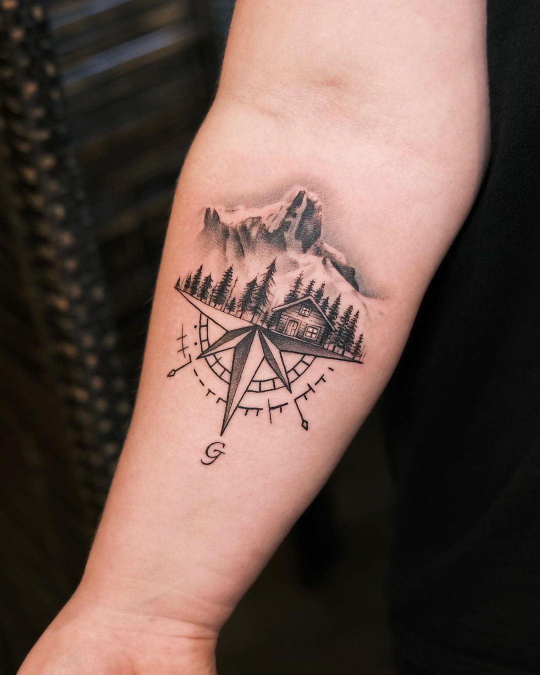 Compass Tattoo With Alpine Vista On The Forearm