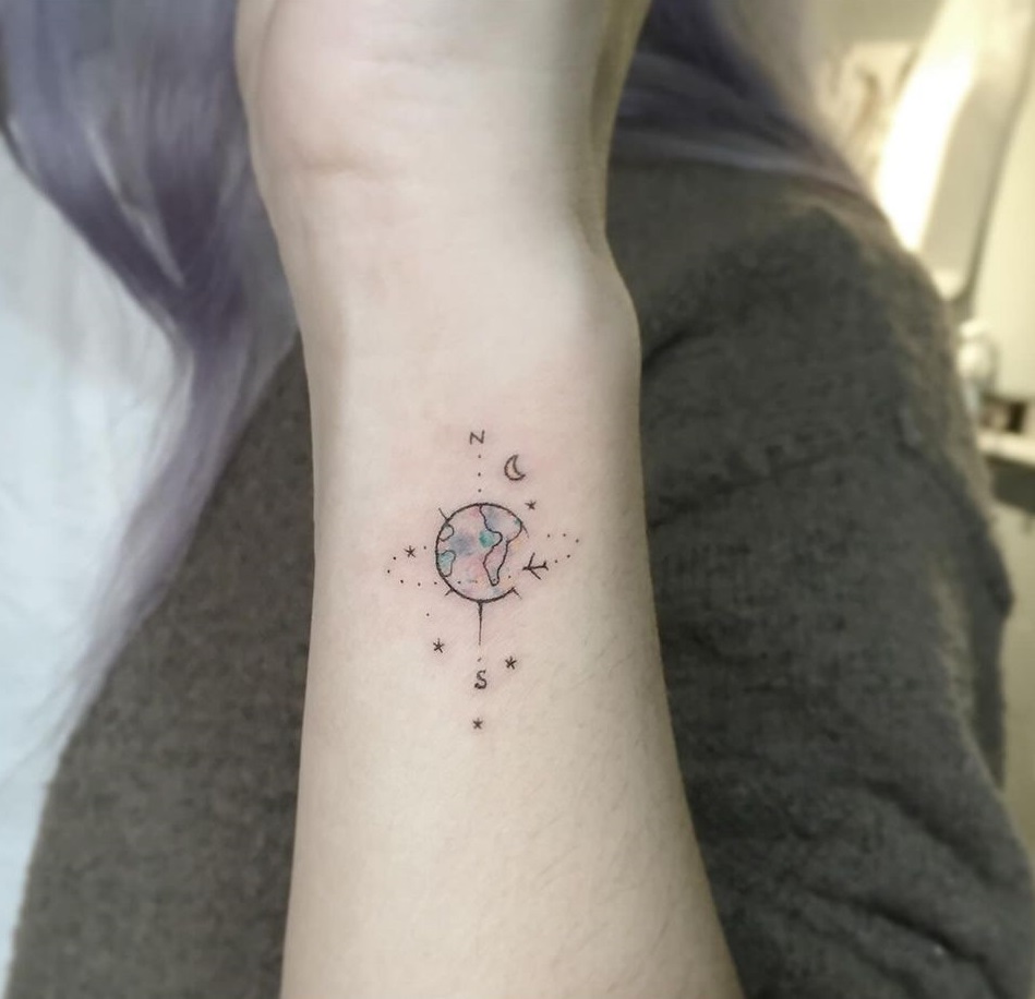 Compass Of Earth And Moon Inked On Skin