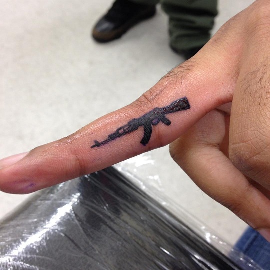 Ak47 Tattoo On Finger