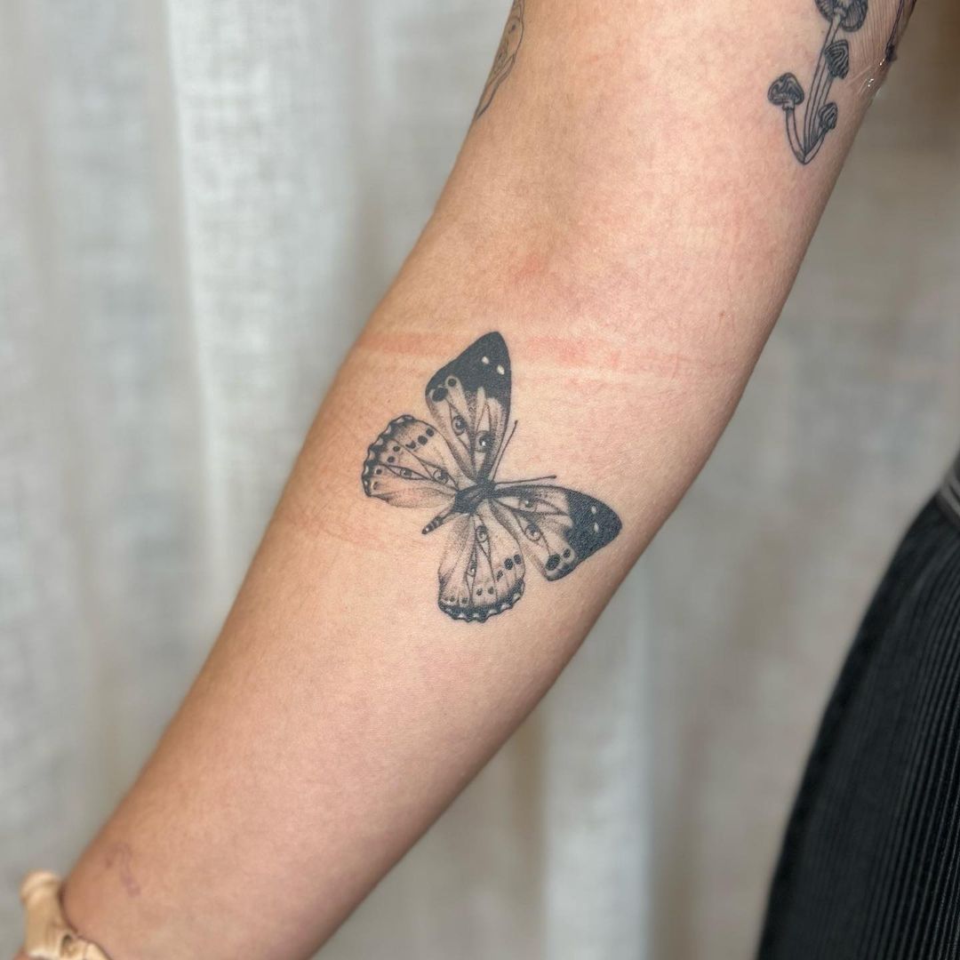 Dotted Butterfly Forearm Tattoo