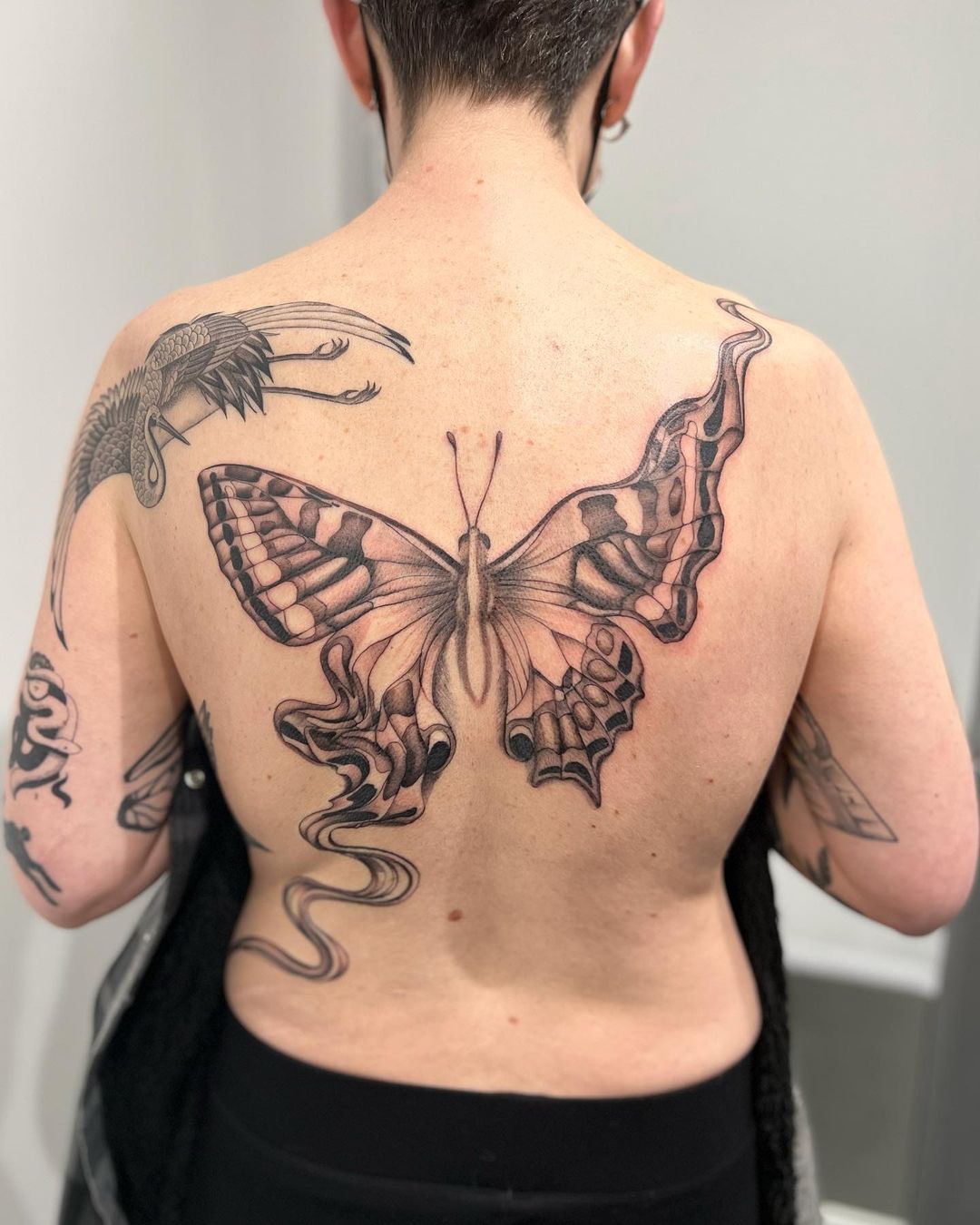 Dynamic Japanese Butterfly Back Tattoo