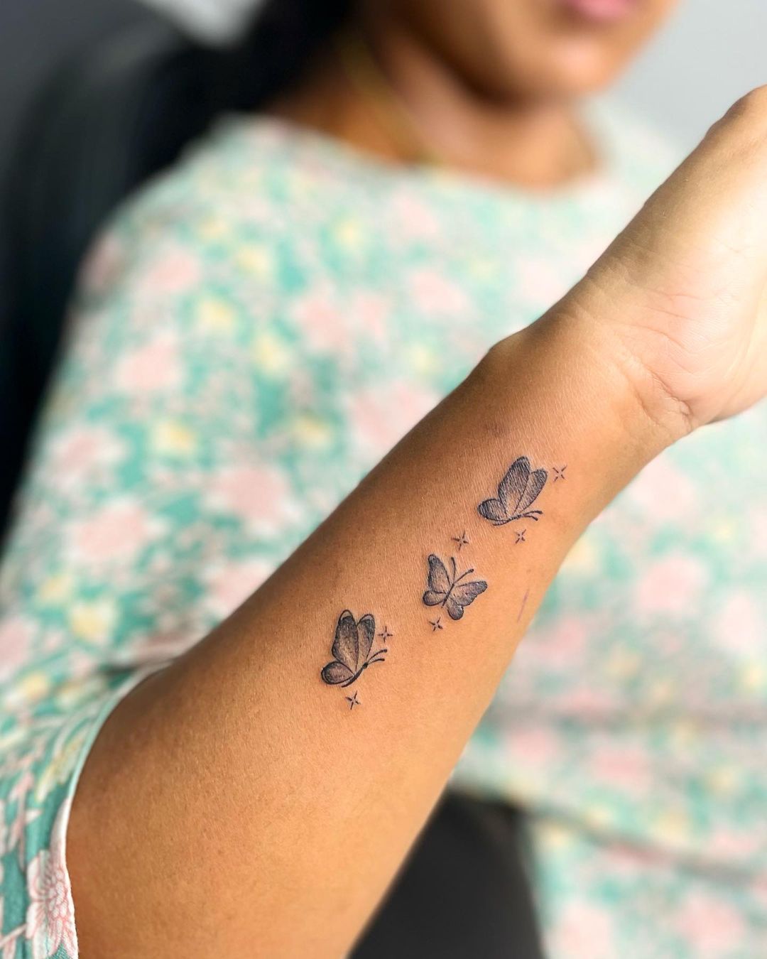 Fine Line Butterfly Arm Tattoo