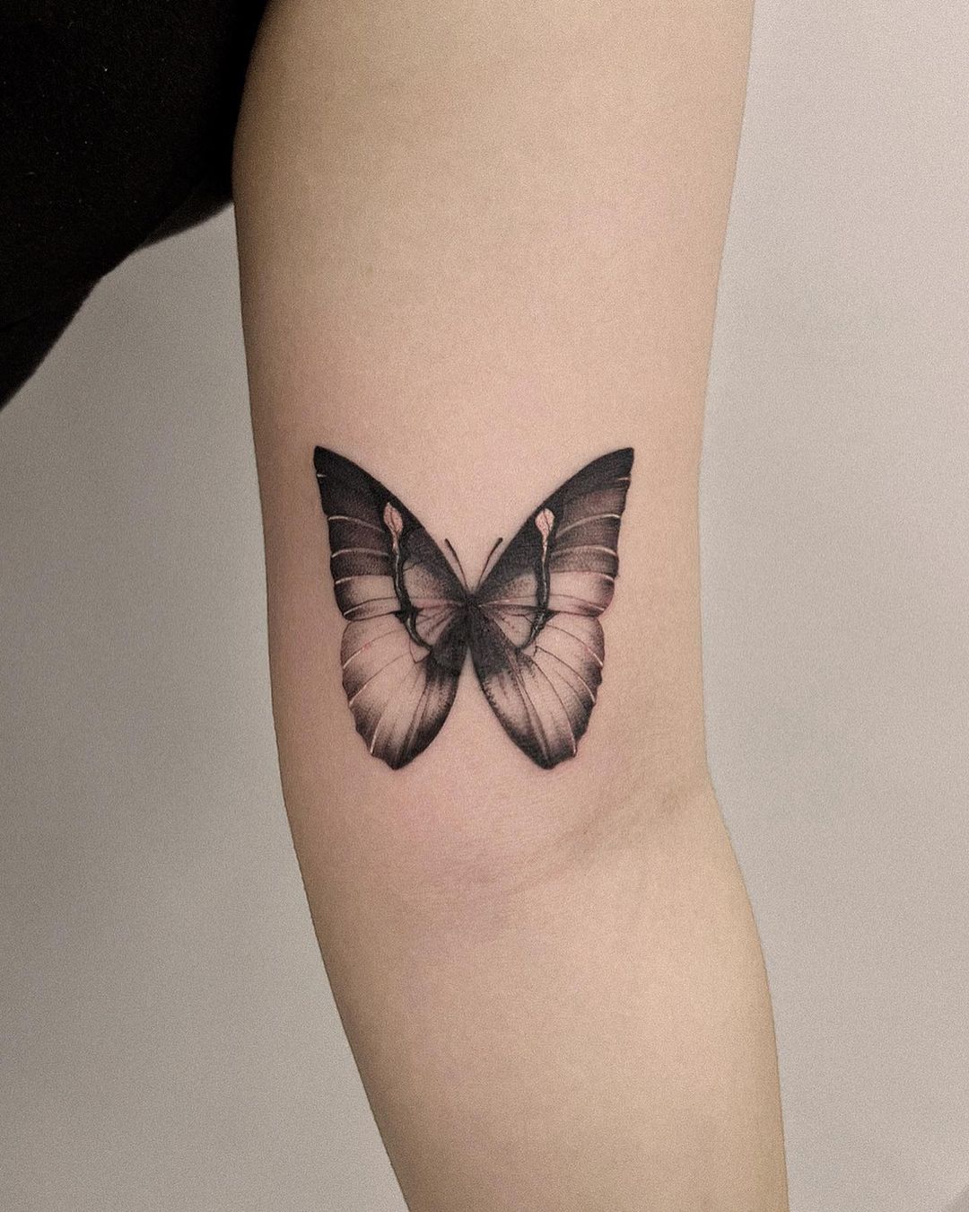 Realistic Black And Grey Butterfly Forearm Tattoo